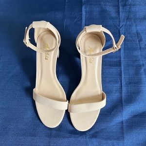 Size 7 beige sandal with 2 1/2” chunky heel & ankle strap